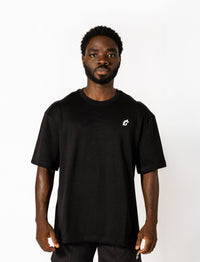  Oversized black tee with white lettering "Conquer Your Demons," perfect for training, layering, or relaxed casual outings.