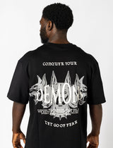  Oversized black tee with white lettering "Conquer Your Demons," perfect for training, layering, or relaxed casual outings.